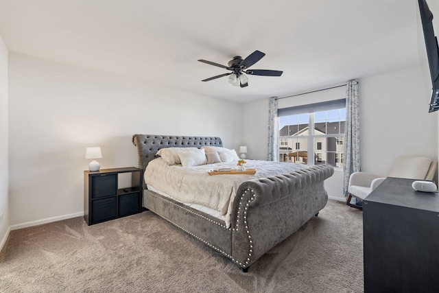 carpeted bedroom featuring a ceiling fan and baseboards