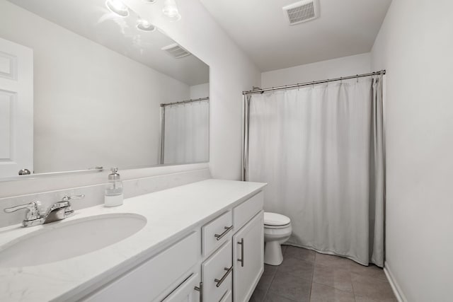 full bathroom featuring toilet, vanity, tile patterned flooring, and visible vents