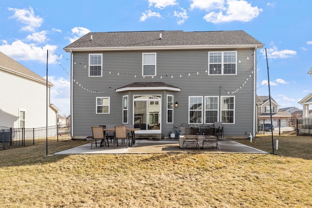 back of house featuring a patio area, a yard, and a fenced backyard