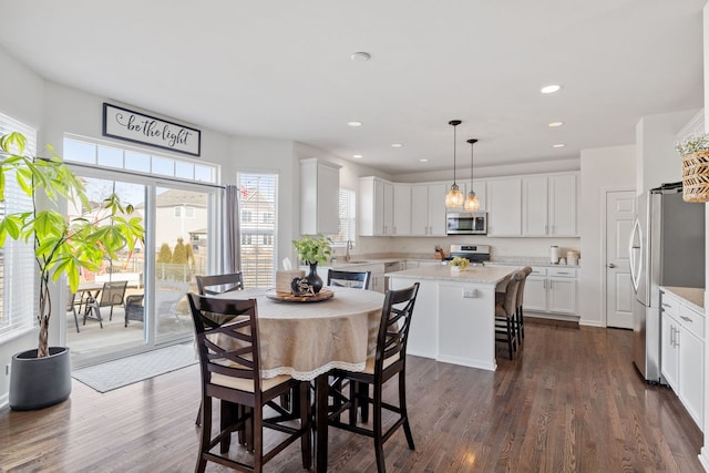 dining area featuring dark wood-style floors and recessed lighting