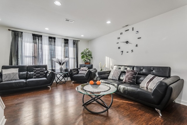 living area with dark wood-style floors, visible vents, and recessed lighting