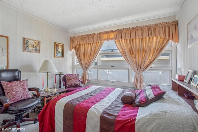 bedroom featuring a textured ceiling and crown molding