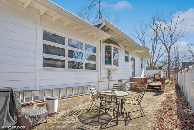 view of patio / terrace featuring fence