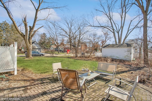 view of patio featuring a storage shed and an outdoor structure