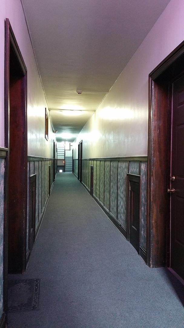 hallway featuring carpet flooring