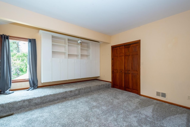 unfurnished bedroom with carpet floors