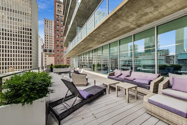 wooden terrace featuring an outdoor living space