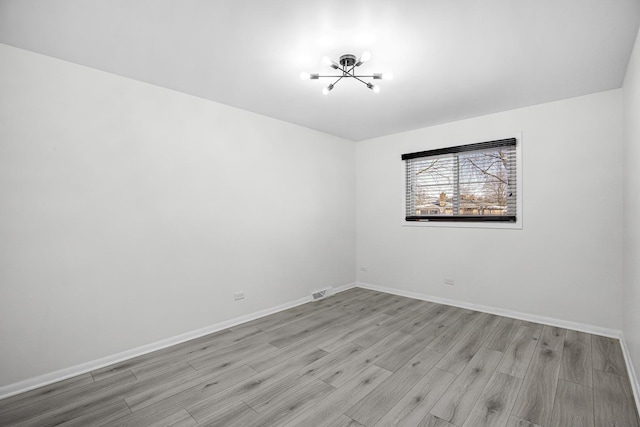 empty room with light wood-type flooring