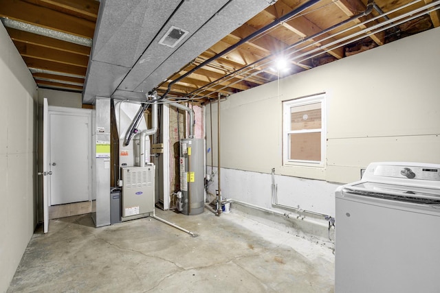 basement featuring heating unit, washer / dryer, and gas water heater