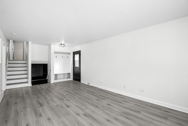 unfurnished living room with light wood-type flooring