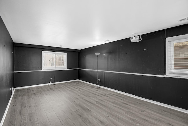 spare room featuring hardwood / wood-style floors