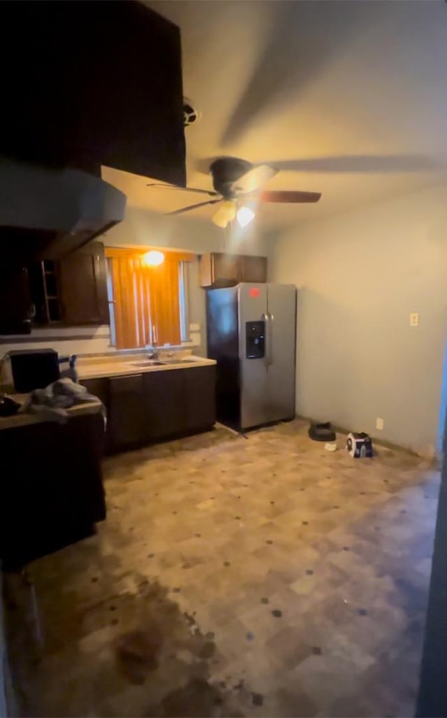 kitchen featuring ceiling fan and stainless steel refrigerator with ice dispenser