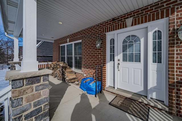 view of exterior entry with covered porch