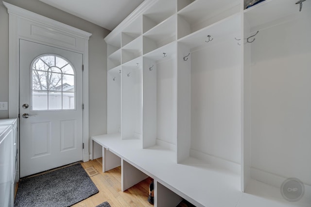 mudroom with light hardwood / wood-style flooring