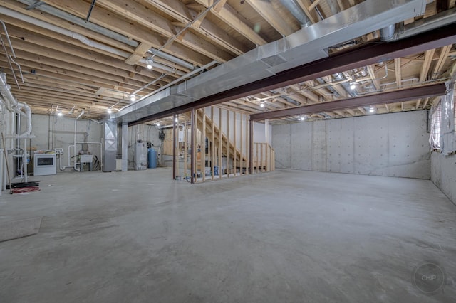 basement with heating unit and gas water heater