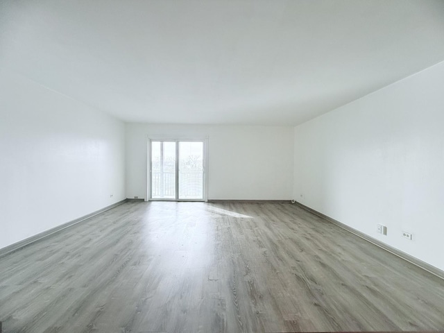 spare room with light hardwood / wood-style floors