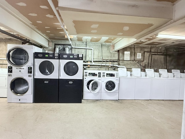 laundry room featuring washer and dryer and stacked washer and clothes dryer