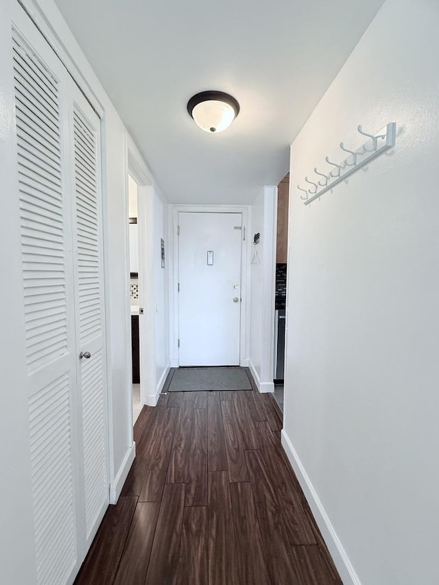 corridor featuring dark wood-type flooring