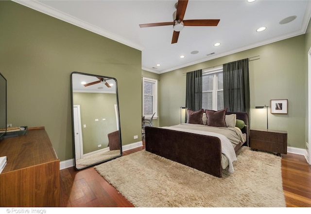 bedroom with baseboards, recessed lighting, wood finished floors, and crown molding