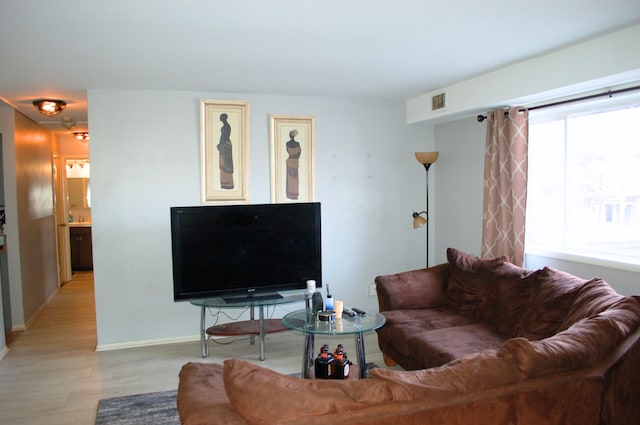 living room with light hardwood / wood-style flooring