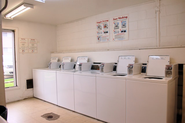 clothes washing area featuring washing machine and clothes dryer