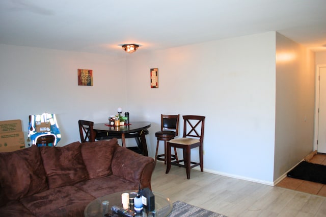 living room with light hardwood / wood-style flooring