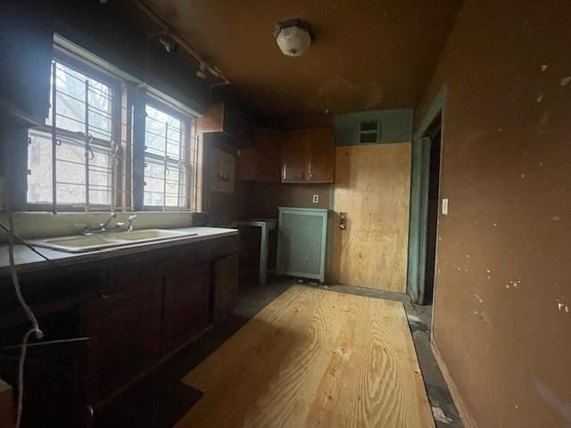 kitchen featuring sink and rail lighting