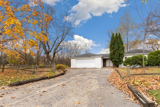 view of side of home featuring a garage