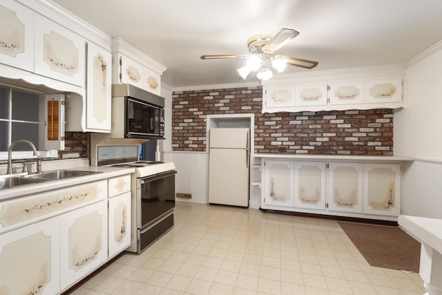 kitchen with white appliances, sink, crown molding, brick wall, and white cabinets