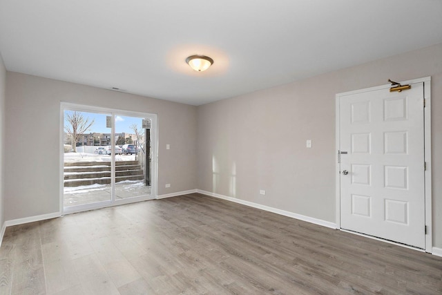 unfurnished room featuring hardwood / wood-style floors