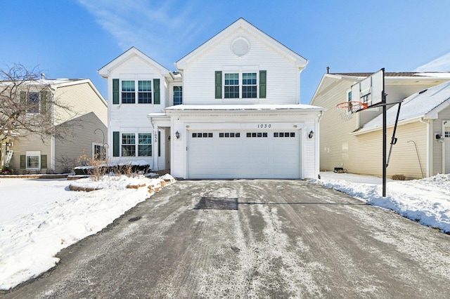 traditional home featuring a garage and concrete driveway