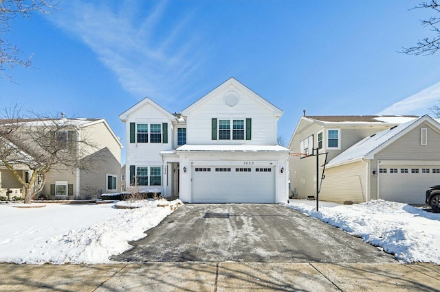 traditional-style home featuring concrete driveway and an attached garage