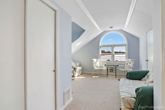 living area with baseboards, visible vents, vaulted ceiling, and carpet flooring