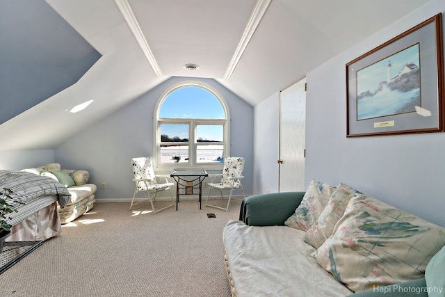 carpeted living area with baseboards, visible vents, and vaulted ceiling