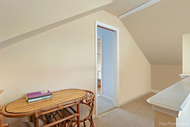 bonus room featuring light carpet, baseboards, and lofted ceiling