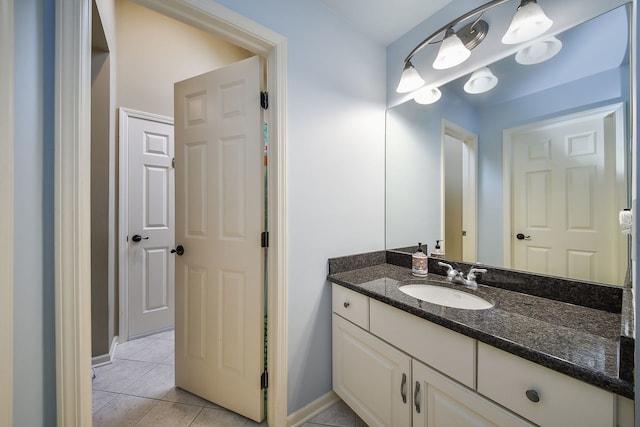 bathroom with tile patterned floors and vanity