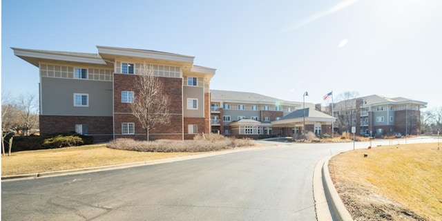 view of street featuring curbs and a residential view