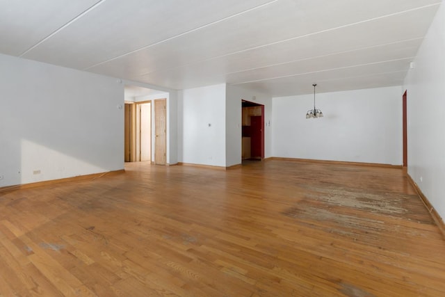 empty room with light hardwood / wood-style floors