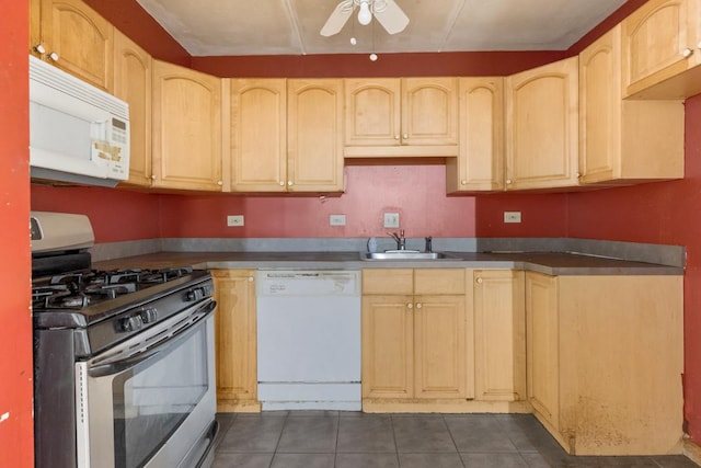 kitchen featuring sink, white appliances, dark tile patterned flooring, ceiling fan, and light brown cabinets