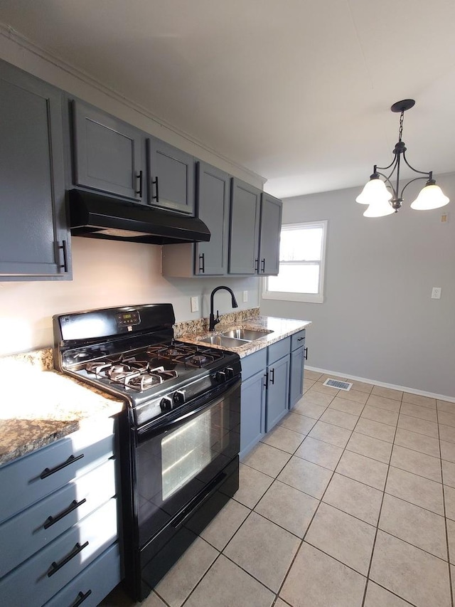 kitchen featuring light tile patterned floors, visible vents, black range with gas stovetop, a sink, and under cabinet range hood