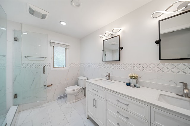 bathroom with a marble finish shower, visible vents, marble finish floor, and a sink