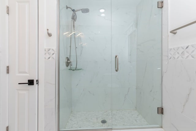 full bathroom featuring a shower stall