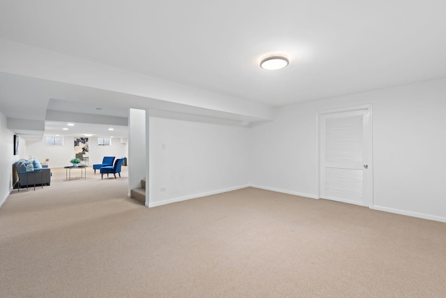 finished basement with stairway, carpet flooring, recessed lighting, and baseboards