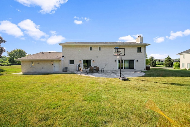 rear view of house featuring a patio area, a lawn, cooling unit, and a chimney