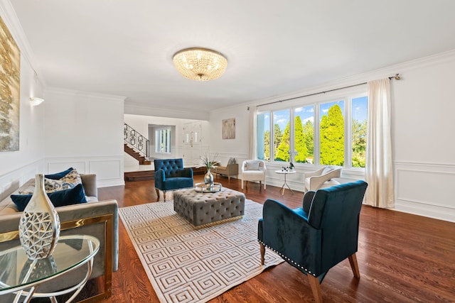 living room featuring ornamental molding, stairs, and wood finished floors