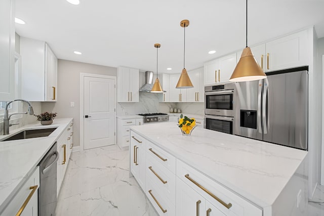 kitchen featuring marble finish floor, a sink, tasteful backsplash, appliances with stainless steel finishes, and wall chimney exhaust hood