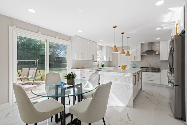 dining space featuring recessed lighting and marble finish floor