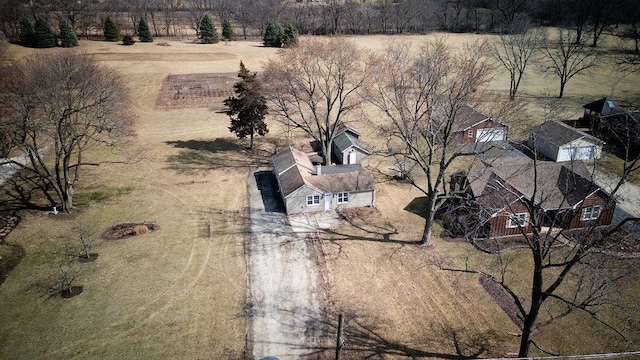 birds eye view of property with a rural view