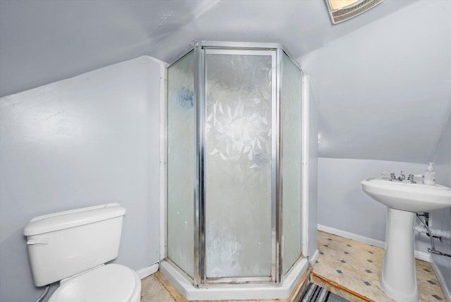 bathroom featuring vaulted ceiling, visible vents, a shower stall, and toilet