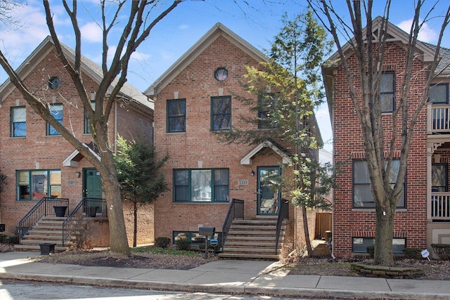 view of front of house featuring brick siding